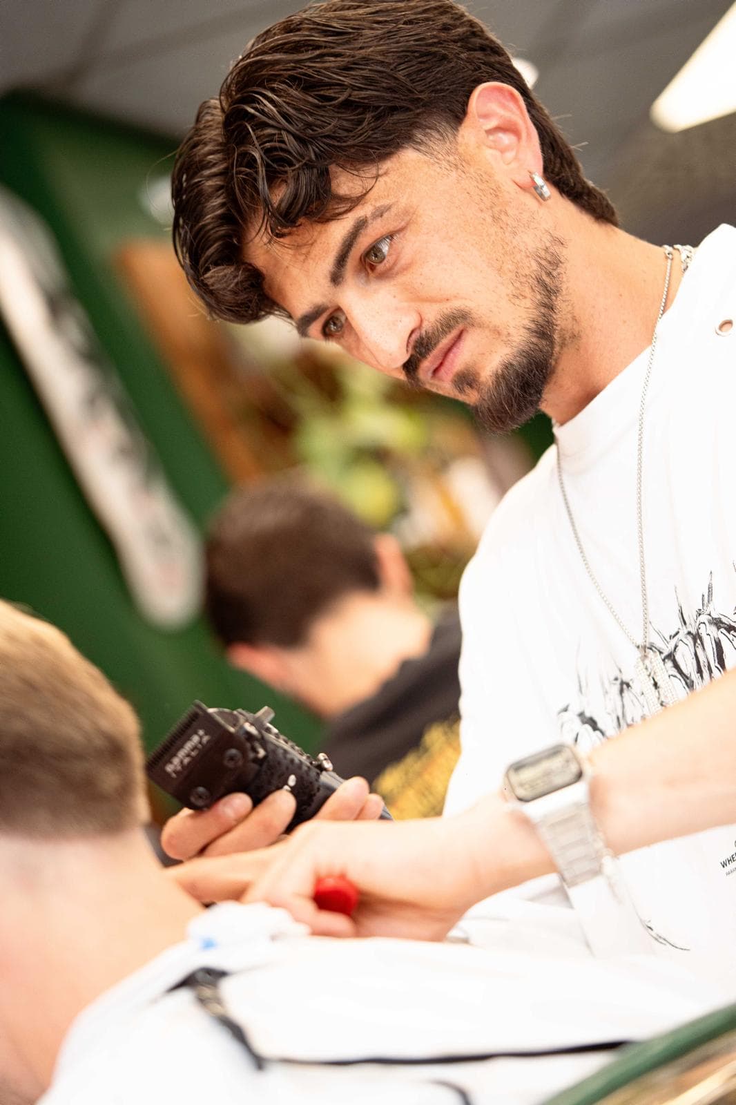 Barber giving a precision beard trim at Porem Barbershop Amsterdam