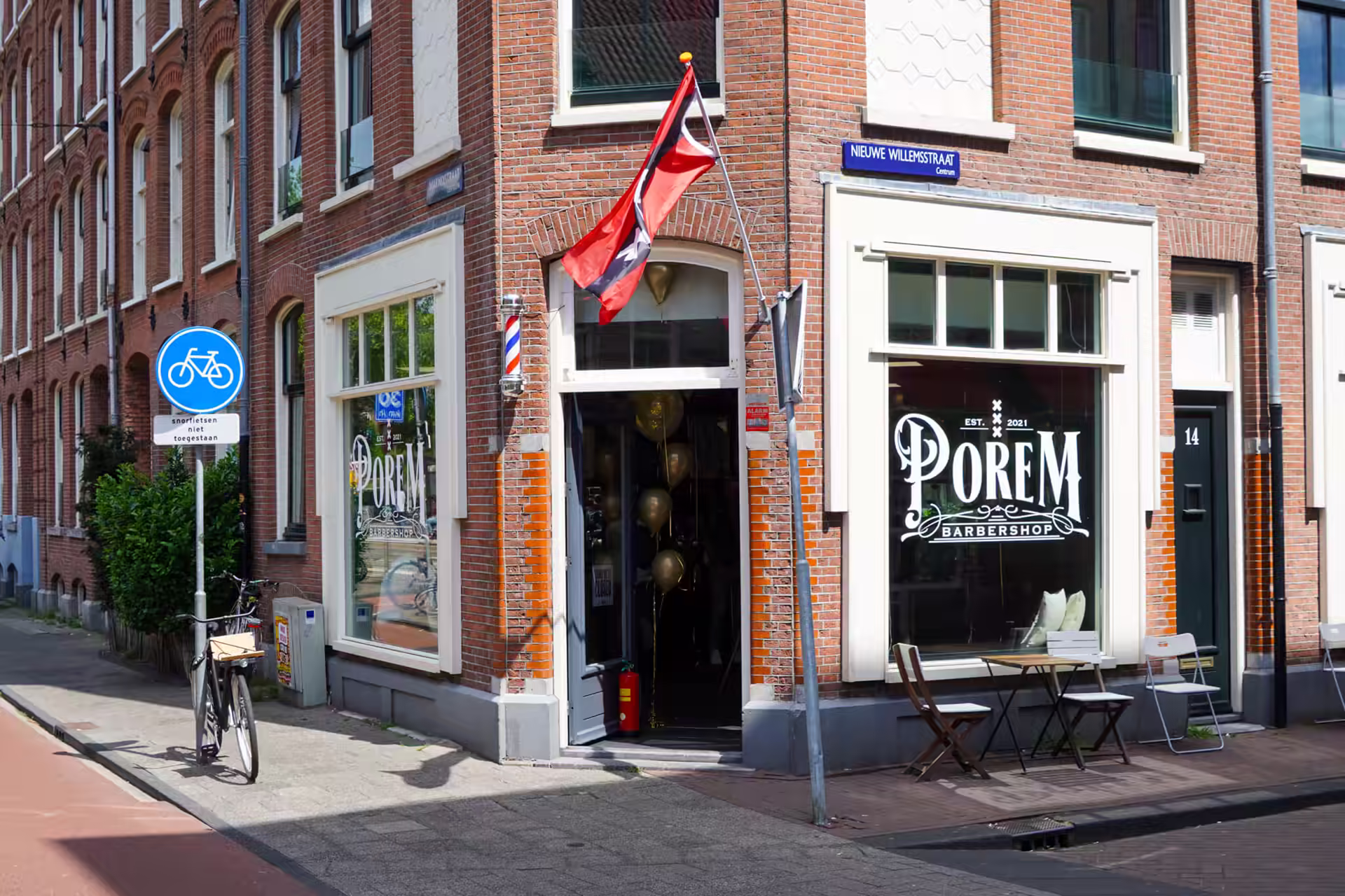 The entrance to Porem Barbershop on Nieuwe Willemsstraat in the Jordaan, Amsterdam